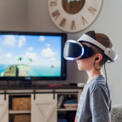 Boy Using Virtual Reality Goggles 3391378